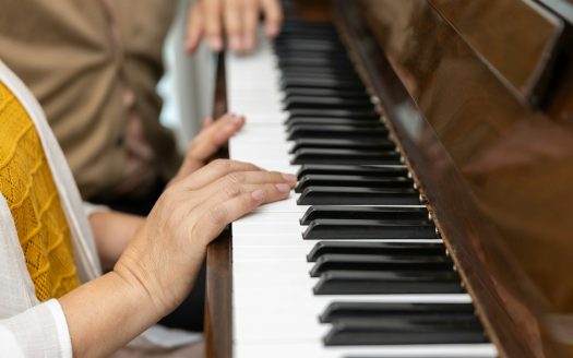 closeup elderly hands playing playing classic piano. classical pianist senior learning.